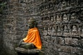 Ancient Buddha statue in orange cover Royalty Free Stock Photo