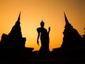 Ancient Buddha Statue and Pagodas at Sunset, Sukhothai, Thailand