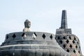Ancient Buddha statue and stupa at Borobudur temple in Yogyakarta, Java, Indonesia. Royalty Free Stock Photo