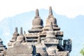 Ancient Buddha statue and stupa at Borobudur temple in Yogyakarta, Java, Indonesia. Royalty Free Stock Photo