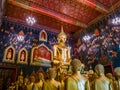 Ancient Buddha statue in Thailand with mural painting around. Royalty Free Stock Photo