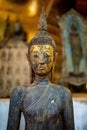 Ancient Buddha statue at Wat Visoun in Luang Prabang, Laos, Southeast Asia