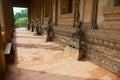 Ancient Buddha statues located along the outside wall of the Hor Phra Keo museum building in Vientiane, Laos.