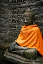 Ancient Buddha statues in orange cover Royalty Free Stock Photo