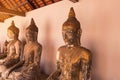 Ancient buddha statues in Wat Phra Borommathat Chaiya Ratchaworawihan temple Royalty Free Stock Photo