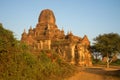 Ancient Buddhist pagoda Tha Kya Pone in rising sun closeup. Old Bagan, Myanmar