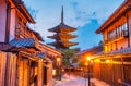 Ancient buddhist temple of Hokan-ji in old town of Kyoto in the early night. Blue glowing sky contrasts with traditional pagoda