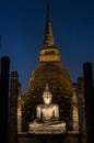 The ancient Buddhist temple of Wat Sa Si in evening twilight. H