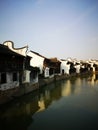 Ancient building reflecting on the peaceful river Royalty Free Stock Photo