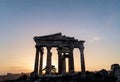 Ancient Temple Ruins at Sunset with Majestic Columns and Dramatic Sky Royalty Free Stock Photo