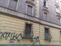 An ancient building with the wall covered by murals in Bologna city Italy