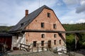 The ancient building of Wesselsky water mill built from red bricks in 16th century Royalty Free Stock Photo