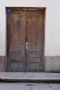 Ancient building with wooden entrance door. Royalty Free Stock Photo