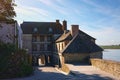 Ancient buildings of the old town of the Mont Saint Michel Abbey in Lower Normandy France at morning time. Sunny spring morning Royalty Free Stock Photo