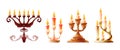 Set of ancient candlesticks with burning wax candles Royalty Free Stock Photo