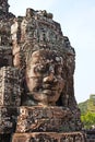 Ancient carved face in Angkor Wat Royalty Free Stock Photo