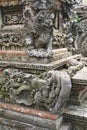 Variety of carved stone gargoyles and ornaments at a temple in Bali Indonesia