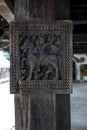 An ancient carving depicting a man riding a horse at Embekke Devale in Sri Lanka.