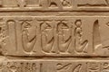 Carvings of pharaohs, Egyptian gods, and hieroglyphics on interior walls of the temple Royalty Free Stock Photo