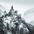 Ancient castle, on the background of alpine rocks, high towers with sharp spiers