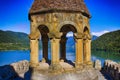 Ancient castle in the mountains over the lake. Sunny summer day