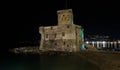 The ancient castle on the sea by night, Rapallo, Ligurian riviera, Genoa province, Italy Royalty Free Stock Photo