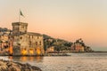 The ancient castle on the sea at sunset, Rapallo, Genoa Genova, Italy Royalty Free Stock Photo