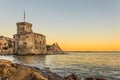 The ancient castle on the sea at sunset, Rapallo, Genoa Genova, Italy Royalty Free Stock Photo