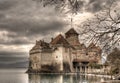 Ancient castle stands atop a rocky island in the middle of a tranquil lake