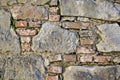 Ancient castle wall made of red bricks and large field stones Royalty Free Stock Photo