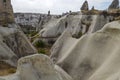 Ancient cave homes and rock formations in colourful Pigeon Valley in Cappadocia, Turkey