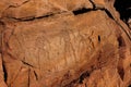 Ancient cave paintings of people carved in stone