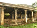 Ancient cave temple with ornate pillars at top of mountain