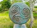 Ancient celtic Triskele or Triple Spiral symbol in bronze Royalty Free Stock Photo