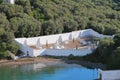 Ancient cemetery on coast of sea gulf. Mahon, Minorca, Spain