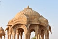 Ancient cenotaph with modern windmills in bada baag Jaisalmer Rajasthan India Royalty Free Stock Photo