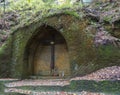 Ancient chapel carved in sandstone rock Modlivy Dul dedicated to the Virgin Mary of Lourdes in beautiful autumn forest near Royalty Free Stock Photo