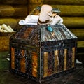 Ancient chest with old documents on table