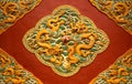 Fretwork in the form of a dragon on the red wall in the Forbidden City. Beijing, Royalty Free Stock Photo