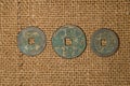 Ancient Chinese bronze coins on old cloth Royalty Free Stock Photo