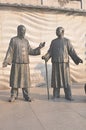 Ancient Chinese bronze sculpture artwork, jar statues, ancient men discussing problems,