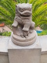 Ancient Chinese Emperor lion statue on a stone pedestal