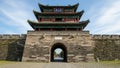 Ancient chinese gate tower architecture with stone wall under blue sky Royalty Free Stock Photo