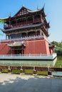 Ancient Chinese tower in lake on sunny day Royalty Free Stock Photo