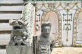 Ancient Chinese Warrior and Lion Stone Statue at Wat Arun or Temple of Dawn Royalty Free Stock Photo