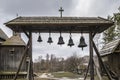 Ancient Church Bells near old Slavic traditional wooden church. Tourist attraction at Pyrohiv park, Ukraine