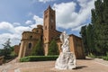 Ancient Church on the Mountain in Tuscany, Abbazia di Monte Oliveto Maggiore with Statue and Road Royalty Free Stock Photo