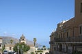 Ancient Church of San Pancrazio against blurred seaside. Clear blue sky on a sunny day. Royalty Free Stock Photo