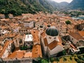 Ancient church of St. Nicholas among the red roofs of houses in the town of Kotor. Montenegro. Drone Royalty Free Stock Photo