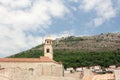 Ancient church top view, and stairs of Dubrovnik old town, hand made walls build with old bricks and stones, clock tower, bell tow Royalty Free Stock Photo